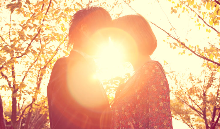 Couple in front of sunset