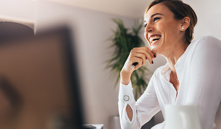 Caucasian Female Business Professional Smiling Into Distance