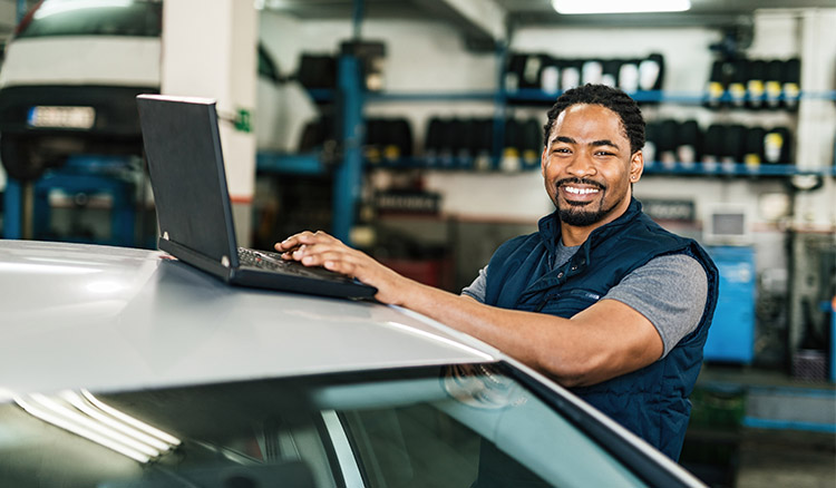 African American Man Working In Auto Garage